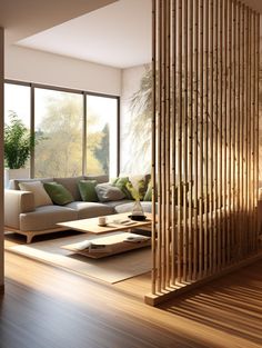 a living room filled with furniture and lots of windows next to a wooden stair case