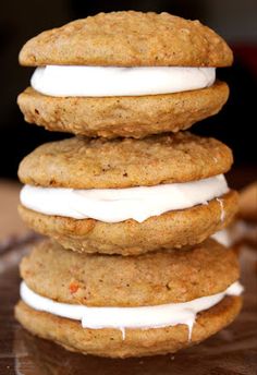 three cookies stacked on top of each other with frosting and icing in between them