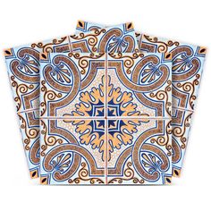 three blue and orange tile designs on the wall, one with an intricate design in the middle