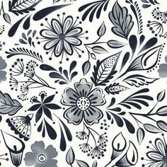 a black and white floral pattern with lots of flowers on it's side,