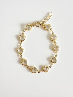 Perfect worn on its own or layered with our other bracelets. *18k gold plated, e-coated (a special coating to not tarnish easily) *E-coated jewelry is hypoallergenic, tarnish resistant *Clear cubic zirconia *Avoid contact with harsh chemicals, perfumes, water, etc. Available in 6"-8" length If you need a custom length, please message me.  Ready to ship Delicate Gold Heart Bracelet For Anniversary, Gold Dainty Crystal Bracelet With Adjustable Chain, Gold Crystal Bracelet With Adjustable Chain, Dainty Style, Gold Elegant Heart Beads Bracelet, Dainty Gold Crystal Bracelet With Adjustable Chain, Elegant Gold Heart Beads Bracelet, Elegant Gold Charm Bracelet With Heart Beads, Gold Heart Beads Bracelets For Wedding, Gold Heart Beaded Bracelets For Wedding