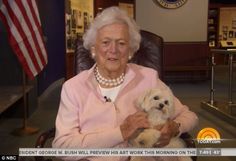 an old woman holding a dog in her lap