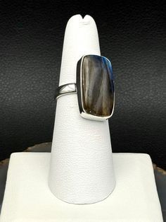 *RING / SIZED (SKU) FEATURES: entirely sterling silver simple bezel setting smooth labradorite rectangle (E4= highest possible quality for this price point) THE STONE: LABRADORITE• intuition• confidence• magic THE METAL: SILVER- moon energy• love• intuition• well-being TIMEFRAME: IN STOCK, WILL SHIP WITHIN 5 BUSINESS DAYS For more information, please call or text us at (828) 299-4751 Moon Energy, Zodiac Cards, Bohemian Bridal, Dangle Hoop Earrings, Chains Necklaces, Silver Moon, Best Candles, Ring Size 7, Bezel Setting