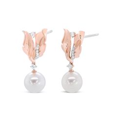 Enlivened by a 8mm round ivory pearl, these drop earrings make a remarkable statement of style on the ears. The graceful elegance of each pearl is accompanied by round white diamonds in prong and pave settings, each placed in an ornate floral leaf display of 14k rose gold. The brilliant diamonds total 1/6 cttw with an approximate H-I Color and I1-I2 Clarity. Push back findings keep these pierced earrings safe and secure on your ears for comfortable wear all day long. Affirmation Jewelry, Rose Gold Pearl, Radiant Diamond, Ivory Pearl, Brilliant Diamond, Pearl Studs, Chains For Men, Gold Pearl, Cultured Pearls