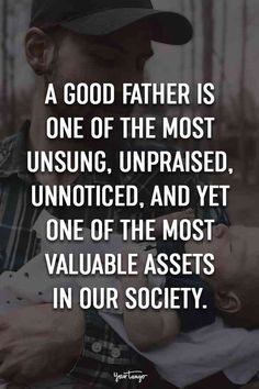 a man holding a baby in his arms with the words, a good father is one of