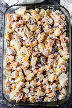 a glass casserole dish filled with potato salad