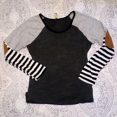 Super Cute Top It's Almost Like A Baseball Type Of Shirt, Except It's So Much More Pretty And Stylish, It's Dark Grey With Light Grey Sleeves Above The Elbow Then Becomes Striped With Black And White Stripes On The Elbow Of It There's A Beige Colored Spot And It's Something That Just Adds To The Top , It's A Fresh Modern Design. This Top Has Only Been Tried On, Never Worn. So Buy With Ease, This Top Goes With Many Different Looks, Skinny Jeans,Or Bell Bottoms, Leggings, Or A Skirt. It's Beautifu Fitted Top With Striped Sleeves For Fall, Casual Striped Sleeve Tops For Fall, Casual Tops With Striped Sleeves For Layering, Bell Bottoms Leggings, Spring Crop Tops, Black Velvet Bodysuit, Zara Lace Top, Lace Poncho, Women Shirt Top