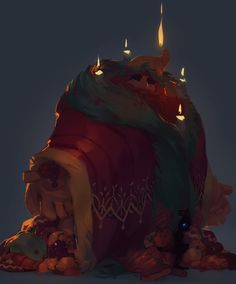 a large bag with candles on top of it sitting in the middle of a pile of rocks