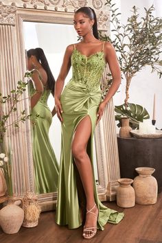 Turn heads in our exquisite embellished satin gown. This fitted silhouette exudes sophistication and style, with its gathered waistline complete with a beautiful fabric knot detail and a leg slit to flatter the legs. The sheer bodice is embellished with intricate beading for a luxurious finish, and the thin straps provide elegant support. Look undeniably exquisite in this piece, and let it be your go-to when you dress to make a statement at all your special occasions Robin Blue, Sheer Corset, Cinderella Divine, Exquisite Gowns, Satin Evening Dresses, Sleeveless Gown, Satin Gown, Lace Corset, Formal Dresses Prom