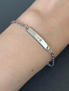 This listing is for a personalized engraved Chinese name mini bar bracelet in stainless steel. Stainless steel jewelry is strong and almost never tarnish or corrode. The sample bracelet is engraved with the name Anna in Chinese in the font #5 on the front and the date in the font #2 and a heart on the back of the bar. Please check the font options in the pictures: the font #3,4 & 5 is only written in traditional Chinese and #6 is only written in simplified Chinese. #1 and 2 is available for both Minimalist Metal Name Bracelet, Dainty Engraved Silver Name Bracelet, Dainty Silver Engraved Name Bracelet, Minimalist Stainless Steel Name Bracelet As Gift, Minimalist Personalized Stainless Steel Name Bracelet, Minimalist Stainless Steel Friendship Name Bracelet, Silver Stainless Steel Name Bracelet For Friendship, Everyday Engraved Stainless Steel Name Bracelet, Silver Engraved Name Bracelet