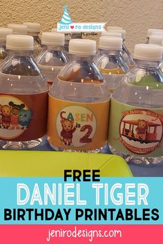 a table topped with lots of water bottles filled with cartoon character labels and the words free daniel tiger birthday printables