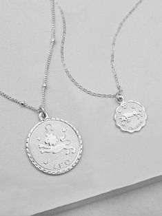 "Rhodium plated Charm on a sterling Silver chain. Small charm measures approximately 0.4 inches (10mm). Large charm measures approximately 0.7 inches (17mm). small necklace measures 16\" and has a 2\" extender for a total length of 18\". large necklace measures 18\" and has a 2\" extender for a total length of 20\" Please read my shop policies to learn more about the composition and proper care for each item purchased. Listing is for one Necklace. Images are meant to show you how the necklace fi Silver Sterling Zodiac Sign Charm Necklace, Silver Round Zodiac Sign Necklaces, Silver Zodiac Sign Round Necklace, Silver Round Zodiac Sign Necklace, Silver Zodiac Charm Necklaces, Silver Zodiac Sign Charm Necklace, Silver Tarnish Resistant Necklace For Birthday, Silver Zodiac Sign Charm Necklace With Round Pendant, Symbolic Silver Necklace For Birthday