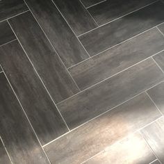 a bathroom floor that has been cleaned and is in the process of being polished with gray tile