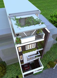 an aerial view of a house with plants growing on the roof