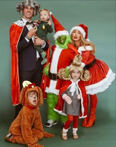 a group of people in costumes posing for a photo