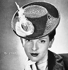 an old photo of a woman wearing a hat