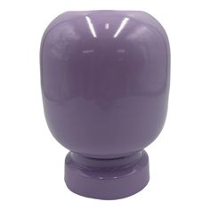 a purple vase sitting on top of a white table