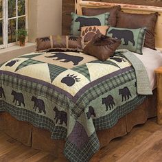 the bed is made with bear themed comforters