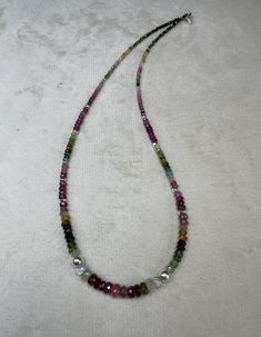 Traditionally, tourmaline is considered a symbol of youth, kindness, love and faith.  The many-sided mineral also symbolizes creativity, flight of thought and imagination, the ability to see magic in ordinary things or create magic out of everyday life.. Made with silver clasps and beads Healing Single Strand Sterling Silver Necklace, Spiritual Tourmaline Gemstone Beads Jewelry, Silver Tourmaline Gemstone Necklace, Faceted Tourmaline Necklace For Gift, Faceted Tourmaline Necklace Perfect As A Gift, Tourmaline Gemstone Beads Necklaces, Spiritual Tourmaline Gemstone Bead Necklaces, Spiritual Tourmaline Gemstone Bead Necklace, Silver Tourmaline Necklaces With Natural Stones