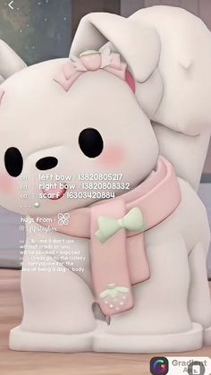 a white teddy bear with a pink scarf around it's neck