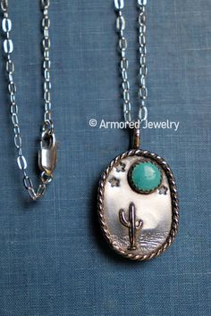 "This is a beautiful sterling silver pendant that features a beautiful desert landscape of a cactus, terrain, stars, and an 8mm Kingman Turquoise stone as the moon. It has a beautiful rope border around the pendant. This pendant hangs on a dainty sterling silver cable necklace. The pendant is 1 3/8\" tall (including bail) x 13/16\" wide. Your choice length of cable chain! Each pendant is handmade when ordered. Therefore, no two pendants will be exactly alike! The pendant you receive will look slightly different than the one pictured here, making each pendant unique!" Untreated Western Style Jewelry For Gifts, Western Style Silver Turquoise Necklace As Gift, Green Western Style Jewelry For Gift, Southwestern Sterling Silver Turquoise Cabochon Necklace, Western Fashion Jewelry, Vintage Turquoise Jewelry, Handmade Turquoise Jewelry, Cactus Jewelry, Rope Border