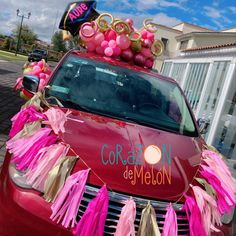 a car decorated with balloons and streamers