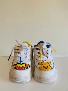 Custom unisex Winnie the Pooh baby/toddler Nike Air Force 1s.  All shoes are hand drawn/painted by me using Angelus Leather Paint and sealed with a matte acrylic top coat to insure that the paint is protected. All shoes will come in their original Nike box packaging. For these orders im ONLY doing Winnie the Pooh characters but feel free to pick any 2 you would like. But if there is something you would like included or excluded on the shoes please include that or message me. (Ex: no color on the Winnie The Pooh Nike, Winnie The Pooh Theme Crocs, Winnie The Pooh Custom Shoes, Winnie The Pooh Nike Air Force 1, Custom Air Force 1 Cartoon Characters, Toddler Nikes, Nike Air Force 1s, Custom Shoes Diy, Nike Air Force Ones