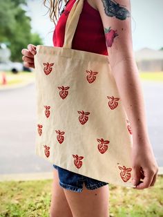 This Strawberry tote is perfect for summer. Bringing in all the vibes. Carved block print and pressed by hand.  Unique and one of a kind. Fabric ink and washable. Printed Bags, Printed Tote Bags, Block Print, Screen Printing, Carving, Bring It On, Tote Bag, Sewing