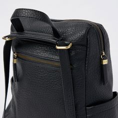 Athena Backpack by Urban Originals has the amazing feature that it can be worn both as a backpack and as a crossbody thanks to its convertible strap. This style is made in a textured vegan leather and it has two side pockets and one frontal zip one. The inside has plenty of practical compartments. Leather Backpack With Zipper Closure And Double Handle, Everyday Backpack With Double Handle And Zipper Closure, Leather Backpack With Adjustable Strap For On-the-go, Versatile Commuter Backpack With Adjustable Strap, Everyday Backpack With Zipper Closure, Everyday Leather Backpack With Zipper, Versatile Backpack With Adjustable Strap For Commuting, Versatile Commuting Backpack With Adjustable Strap, Everyday Leather Backpack With Adjustable Double Handle