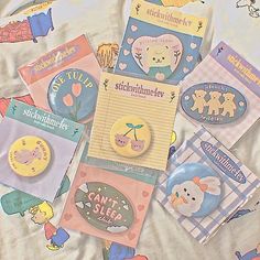 there are many different buttons on the bed sheet that have been made to look like children's books