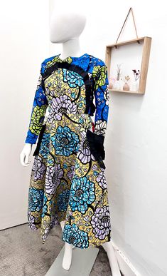 This beautiful long sleeve  dress has strong and vibrant colours. It is made from 100% cotton Ankara fabric and the patterns are mixed.  Designed for durability and comfort, it's perfect for any occasion.  Features  Two side pockets Inner lining  Dress length is 45 inches for  Back zip closure. 100% cotton, no stretch. Model is 6 ft tall and is wearing size 8/10 Flare Dresses Ankara, Ankara Print Dress, Dress Ankara, Ankara Print, Ankara Fabric, Vibrant Colours, Mix And Match, African Print, Flare Dress