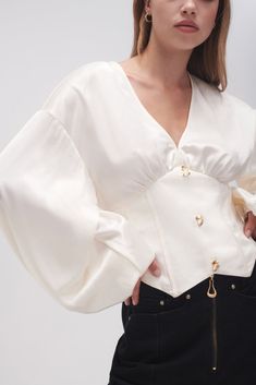 PRODUCT DETAILS Women’s blouse Deep V-neckline Corseted waist panels Full, gathered blouson sleeves Non-functional buttons Angled hemline Shop All Tops SIZE AND FIT Model wears a size 8/S Model: 176cm/5’9.5" Bust: 80cm Waist: 58cm Hips: 88cm FABRICATION 81.5% Acetate 18.5% Polyester Lining: 100% Cotton Delicate Cold Hand Wash Seperately Modern Corset, Victorian Blouse, Straykids Hyunjin Photoshoot, Fashion Design Portfolio, Fashion Mistakes, Blouse Online, Style Mistakes, 10 Pounds, Coconut Cream