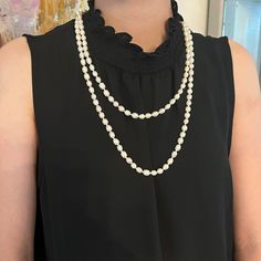 Imagine all the ways you can wear and enjoy 5 feet of pearls! This strand measures sixty inches and is so versatile. Wear it as one long strand, knot it in a lariat style or double it up and it’s still long enough to pull over your head. No need to fuss with a clasp because there is no clasp just a long continuous strand of Freshwater Pearls! The hardest decision is which color to choose but at this price, you can get both! Freshwater Pearls Individually Hand Knotted Available in Black Pearls or Classic Lariat Pearl Necklace With Charm, Classic Lariat Pearl Chain Necklace, Classic Lariat Pearl Necklace, Pearl Strands Necklace, Black Pearls, Pearl Strand, Pearl Strands, Black Pearl, Strand Necklace