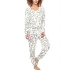 Discover the epitome of relaxation with the Honeydew Intimates Lounge Life Pajama Set, blending style and coziness into your loungewear collection. This jersey knit ensemble pairs a long-sleeve shirt, complete with a comfortable V-neck, with perfectly fitted pants featuring an elastic drawstring waist for a custom fit. Ideal for those lazy weekends or a tranquil night in, this set is your go-to for a cute, cozy experience. Feel pampered in the soft embrace of Honeydew Intimates' luxurious sleepw White Comfortable Sleepwear, Comfortable Relaxed Fit Sleepwear For Relaxing At Home, Comfortable Relaxed Fit Sleepwear For Home, Comfortable Relaxed Fit Sleepwear, Comfy Stretch Sleepwear For Lounging, Comfortable White Sleepwear For Relaxation, Comfortable Long Pants Sleepwear For Relaxation, Relaxed Fit Sleepwear, Cozy White Sleepwear For Loungewear