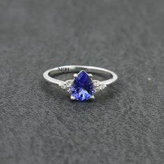 Tanzanite Birthstone Ring With Accent Stones For Promise, Tanzanite Birthstone Promise Ring With Accent Stones, Tanzanite Birthstone Promise Ring, Anniversary Tanzanite Birthstone Ring, Classic Tanzanite Birthstone Promise Ring, Tanzanite Birthstone Ring With Prong Setting Gift, Tanzanite Solitaire Birthstone Ring As Gift, Aquamarine Ring Vintage, Blue Aquamarine Ring