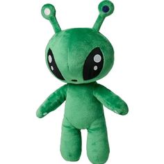 a green stuffed animal with black eyes