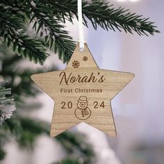 a wooden ornament hanging from a christmas tree