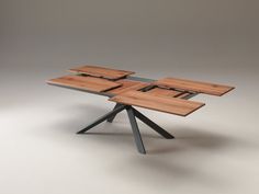 the table is made out of wood and has four pieces of metal on each side