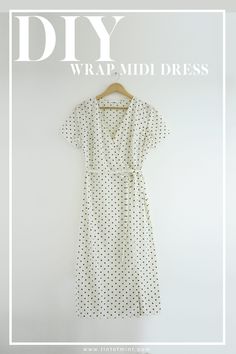 a dress hanging on a hanger with the words diy wrap midi dress above it