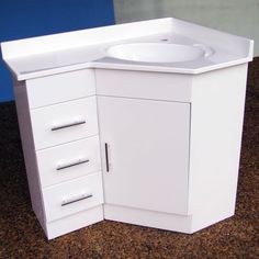 a white sink sitting on top of a counter