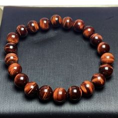 Material: Tigereye Color: 10mm Red Tiger Eye Bracelet Fashion Element: Chinese Knot Style: Original Design Brown 8mm Beaded Round Bracelets, Brown Bracelets With 8mm Beads, Brown Bracelet With 8mm Round Beads, Brown Round Bracelets With 8mm Beads, Blue Bracelets, Red Tiger, Red Tigers Eye, Tiger Eye Bracelet, Chinese Knot