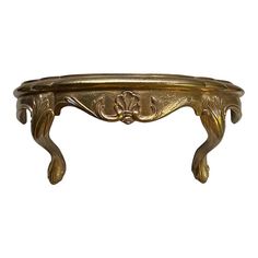 an ornately decorated console table against a white background for use as a centerpiece