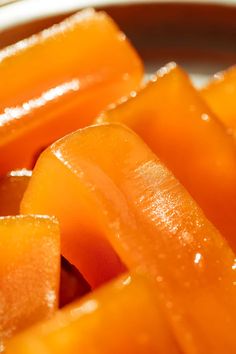 sliced carrots in a bowl with water droplets on them