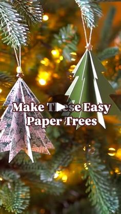 two paper trees hanging from a christmas tree with the words make these easy paper trees