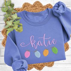 Get cozy and show off your style with this personalized Christmas lights embroidered name Sweatshirt. It's the perfect addition to your winter wardrobe, featuring an embroidered snowman monogram. Stay warm and playful all season long! 7.8 oz., cotton/polyester blend air jet yarn for softness 1x1 ribbed cuffs CARE INSTRUCTIONS Machine wash cold, inside out, with like colors. Tumble dry medium. Embroidered Name Sweatshirt, Embroidered Snowman, Name Sweatshirt, Christmas Light Bulbs, Children Top, Toddler Tops, Tooth Fairy Pillow, Top Backpacks, School Tees