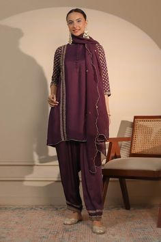 Purple short kurta with dori, cutdana and sequins embroidery in floral butta pattern. Paired with an embroidered hem pant and scallop hem dupatta. - Aza Fashions Purple Kurta With Mirror Work In Traditional Drape, Traditional Drape Kurta With Mirror Work In Chinon, Traditional Draped Kurta With Mirror Work, Purple Georgette Kurta With Mirror Work, Traditional Drape Chinon Kurta With Mirror Work, Fitted Cotton Silk Salwar Kameez With Mirror Work, Straight Kurta Choli With Mirror Work, Unstitched Suit With Mirror Work In Traditional Drape, Party Unstitched Suit With Cutdana