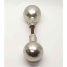 an old fashioned metal door knob on a white background with clipping for the handle