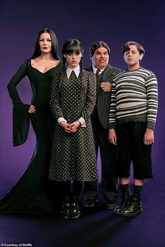 the addams are standing in front of a purple background