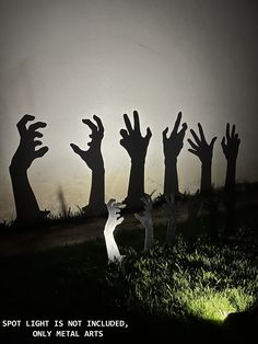 silhouettes of hands reaching up into the sky with text that reads spot light is not included, only metal arts