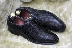 Bespoke Pure Handmade Alligator Textured Black Color Genuine Leather Lace Up Shoes For Men Product Details: Material: Alligator Textured Genuine Leather Upper: Crafted from genuine leather for a luxurious look and feel. Inner: Lined with soft leather, ensuring comfort throughout the day. Sole: Made of durable leather for long-lasting quality. Heel: Features a leather heel for added elegance. Craftsmanship: Handcrafted: Each pair is meticulously hand-stitched to perfection. Manufacturing Time: Please allow 7-10 business days for our skilled artisans to create your custom shoes. Customization: Size and Color: If you can't find your preferred size or color, send us a message, and we'll tailor-make them for you. Measurement: To ensure the best fit, provide your exact measurements, including fo Shoes Customization, Crocodile Loafers, Alligator Dress Shoes, Alligator Crocodile, Leather Formal Shoes, Bespoke Shoes, High Ankle Boots, Leather Brogues, Mens Oxfords